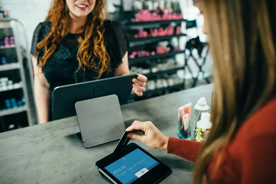 Customer paying by card in a local business